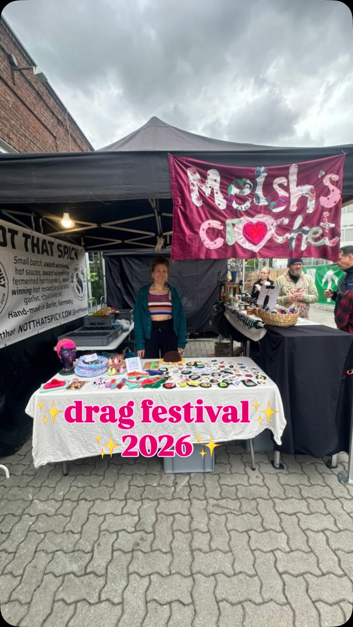 Melsh's Crochet market stall with the hand-stitched banner and crochet pieces